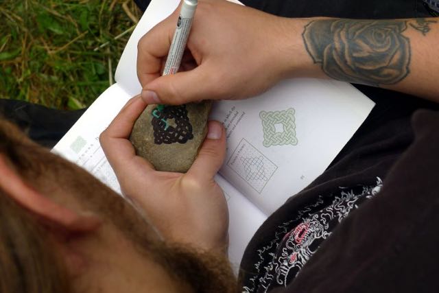 Painting designs on rocks