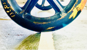 close up of a wheel on edge of curb