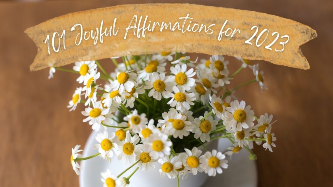 Small white flowers in vase under titles 101 Joyful Affirmations for 2023
