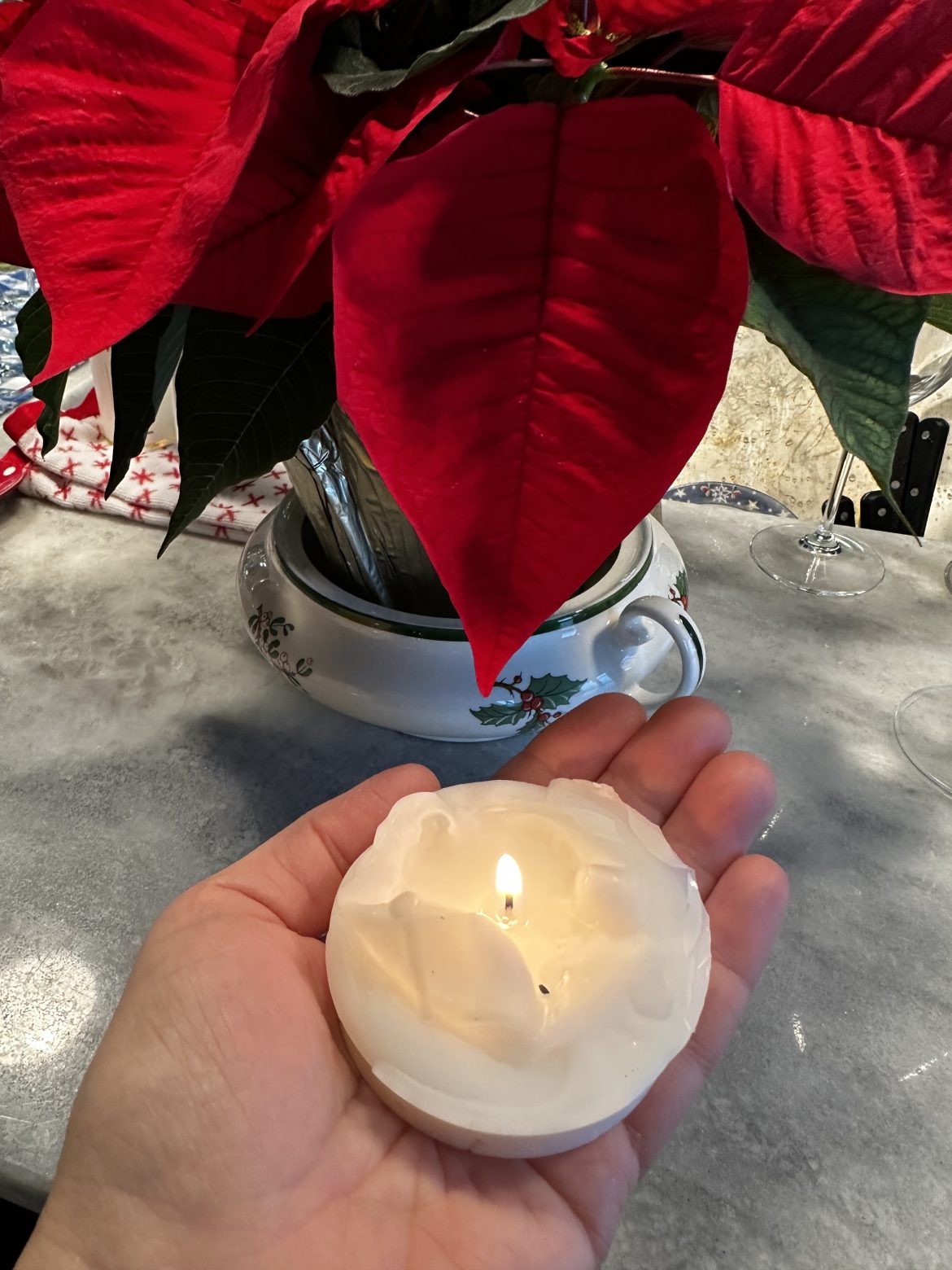 candle and poinsetta